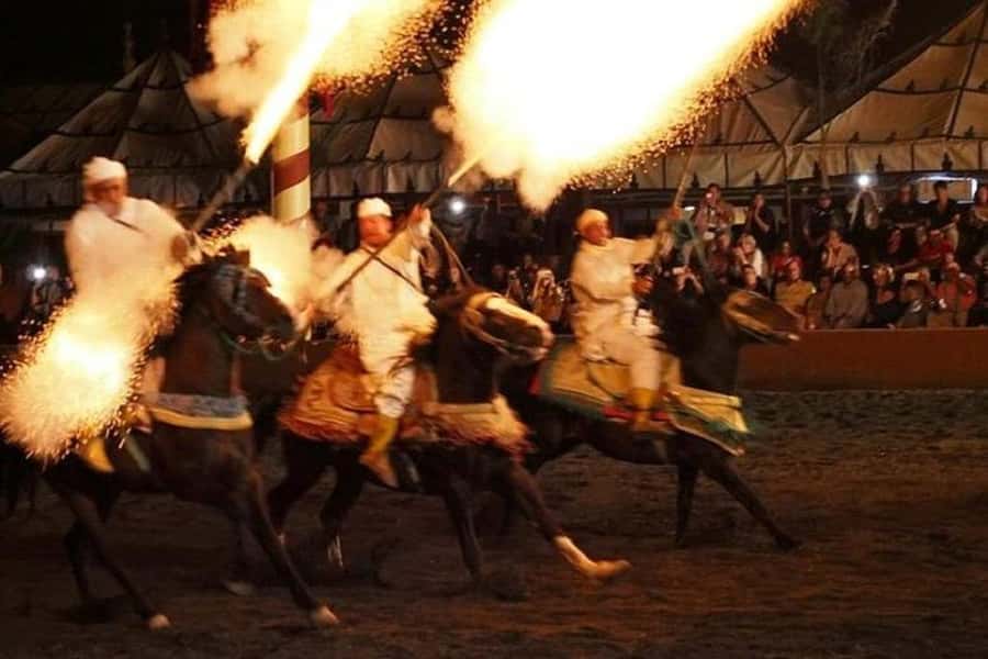 Agadir Fantazia Berber Night Show with Dinner - The Fantasia Show in the stadium: horses, rifle firing, and fire in the sky