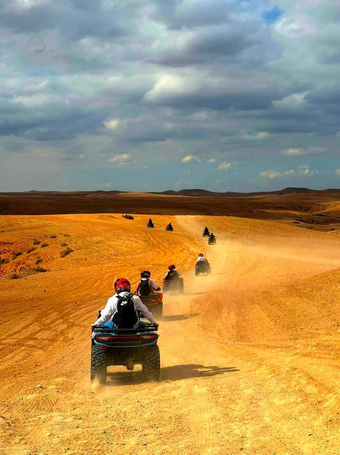 Agafay Tour: Sunset, Dinner, Camel ride, Quad and fire show - Agafay Desert camp time, dinner, music, and the fire show
