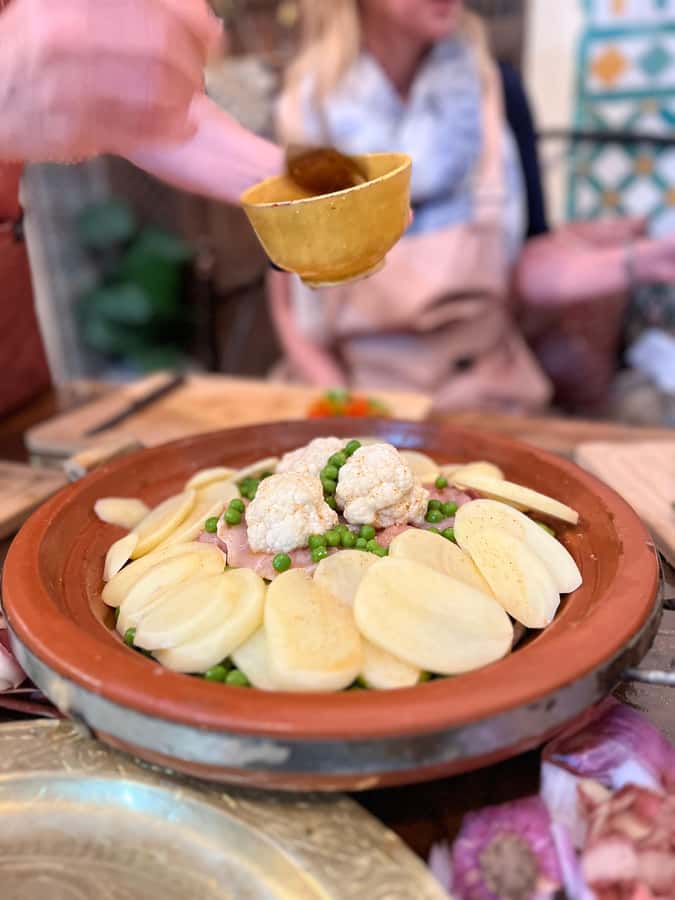 Fez: Souk Tour and Traditional Home Cooking Class - Cooking in a family kitchen: tagine, pastilla, salads, and soup