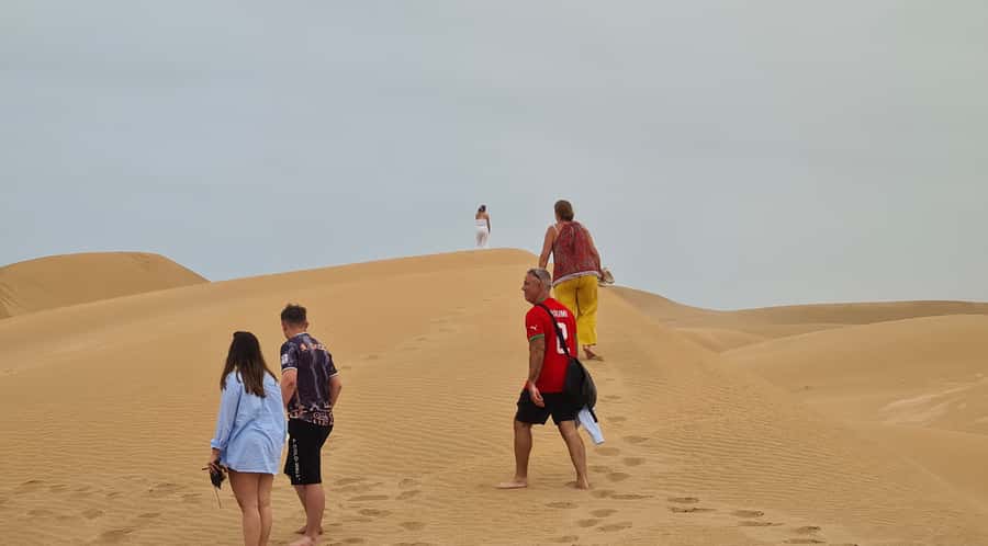 From Agadir: Sahara Desert Day Trip and Camel Ride - Sidi Rbat Beach: cave fishing and a coastline that feels lived-in