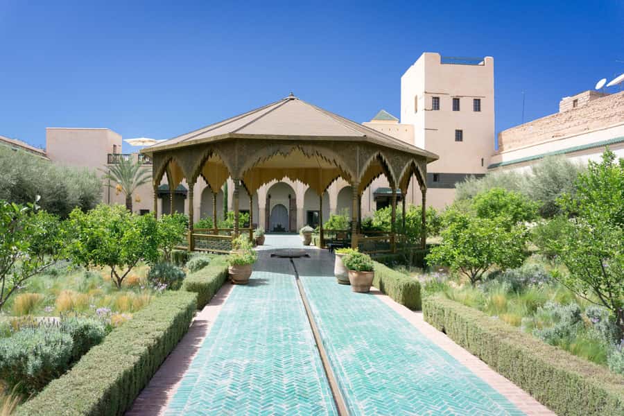 From Casablanca: Marrakech Guided Day Trip with Camel Ride - Jemaa el-Fna Square: street-level Marrakech theater