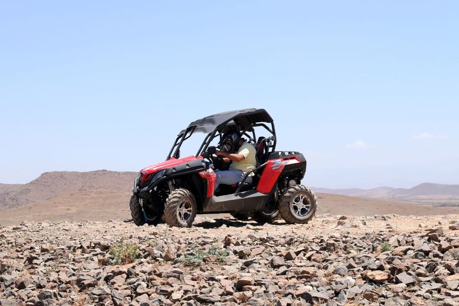 From Marakkesh: Half Day Buggy Adventure in Agafay Desert - High Atlas Mountain views and the Lake Takerkoust return scene