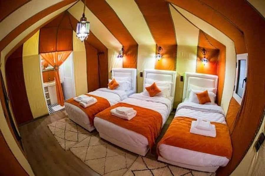 From Marrakech: 3-Day Luxury Desert Tour to Fes via Merzouga - Camel ride and desert camp: what to expect when it gets real