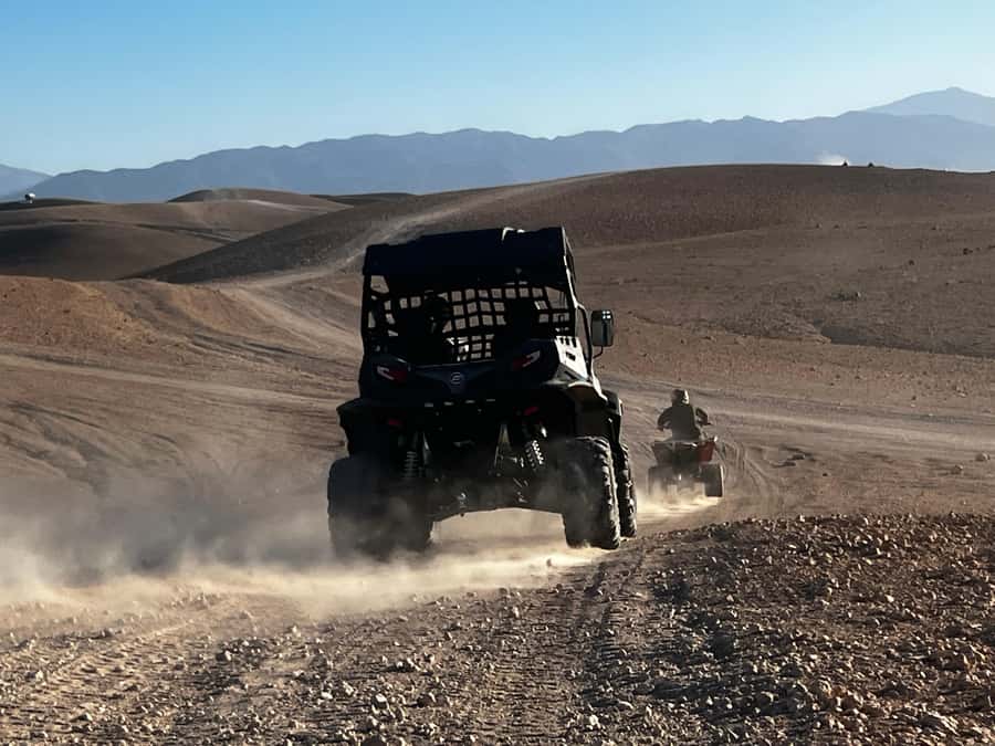 From Marrakech: Agafay Desert Buggy 1Hour & Dinner Show - Dinner with locals under the stars: what to expect