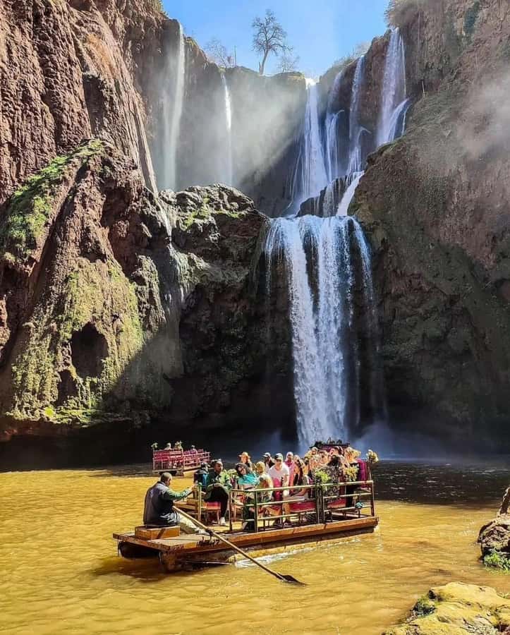From Marrakech:Ouzoud Waterfalls Day Trip with Boat Tour - Arriving at Ouzoud: red cliffs, three falls, and a guided path