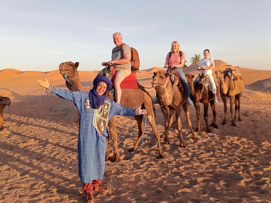 From Merzouga: Overnight Camel Trek over Erg Chebbi Dunes - Day 1 in Erg Chebbi: sunset camel ride, sandboarding, tagine, and drums