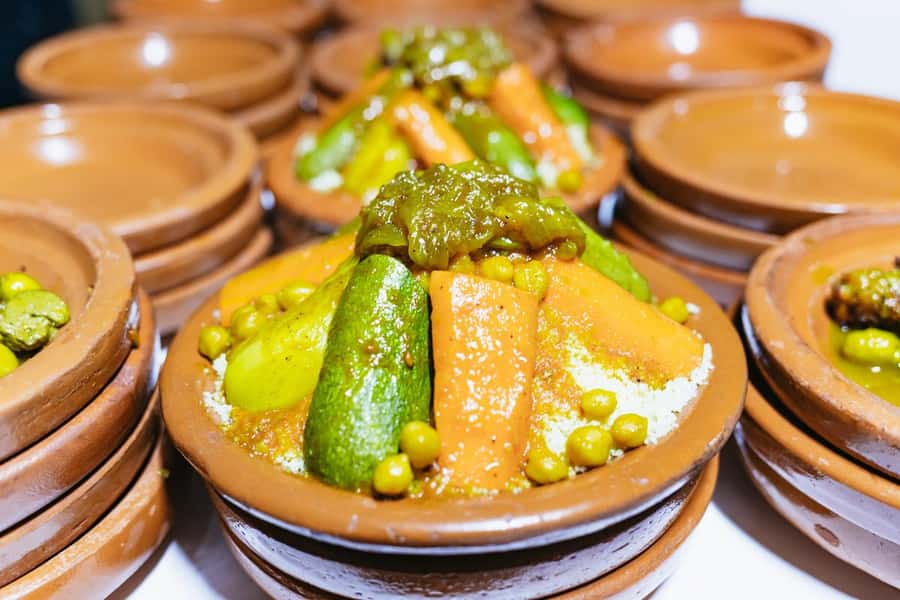 Marrakech: Agafay Desert Retreat, Tent, Dinner, Show & Pool - Dinner under the stars: Moroccan courses plus a show that keeps moving