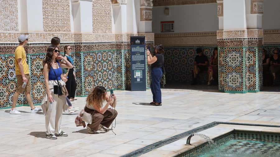 Marrakech: Madrassa Ben Youssef, Secret Garden & Medina Tour - Souk Semmarine and artisan stops: how not to get lost
