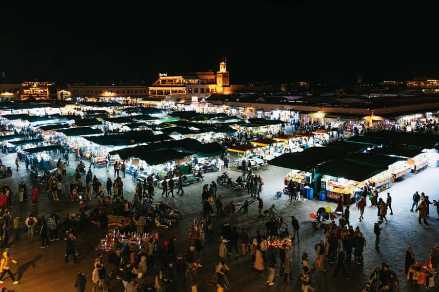 Marrakech: Medina by Night Walking Tour with Moroccan Tea - Rooftop bar finish: views, music, and a slower pace